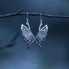 Sterling silver butterfly earrings with delicate wing details and elegant drop design.