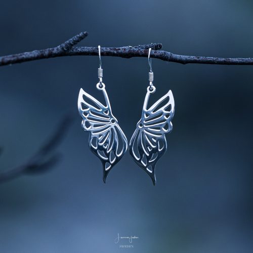 Sterling silver butterfly earrings with delicate wing details and elegant drop design.