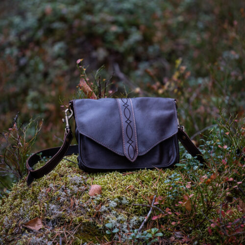 a Handcrafted brown Nordic leather bag made from vegetable-tanned leather.