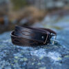 A handcrafted brown leather belt using naturally tanned leather designed with timeless simplicity, natural beauty, and traditional craftsmanship.