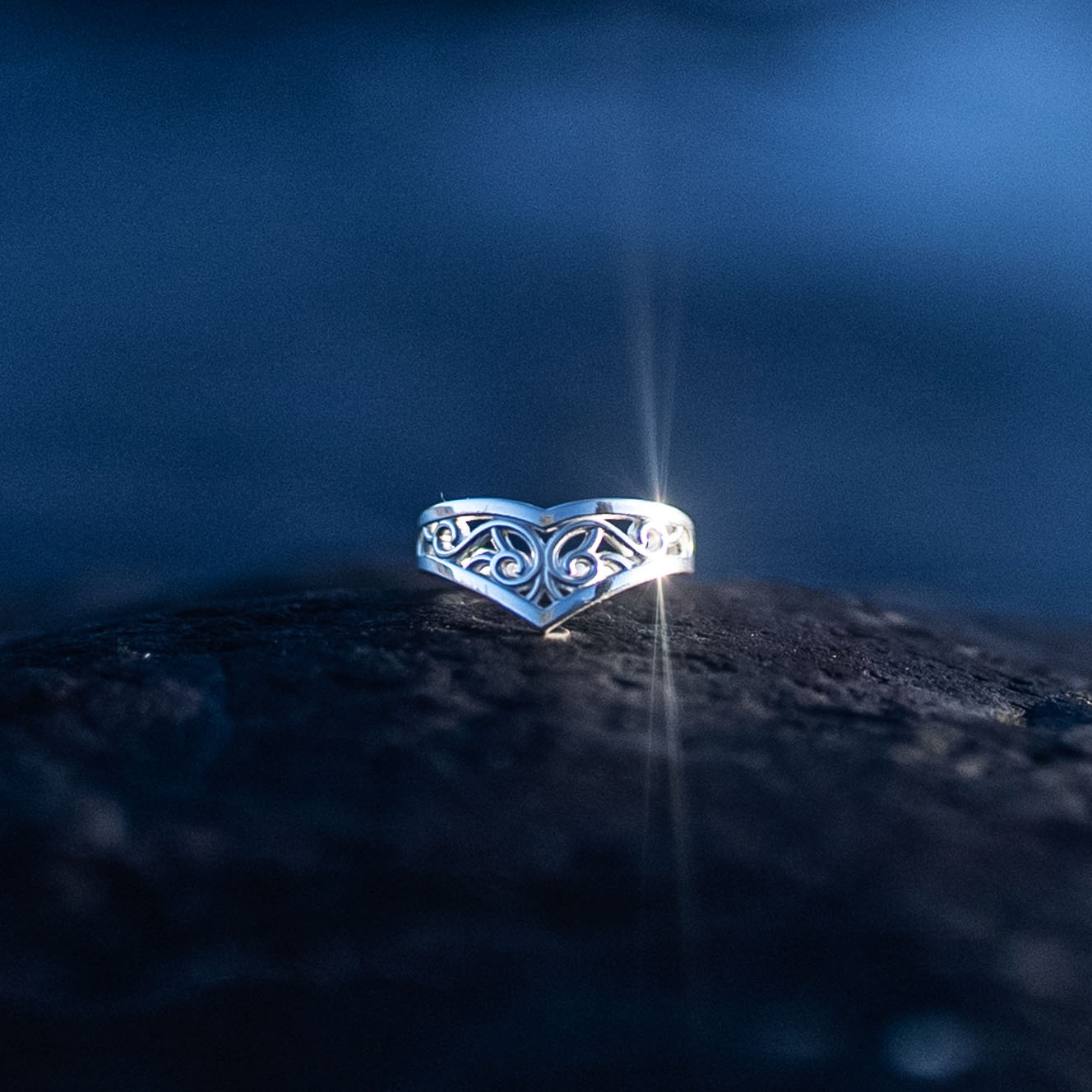 Sterling silver Goddess Ring with an elegant pointed silhouette, intricate engraved details, and a hidden butterfly motif symbolizing transformation.
