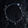 Skir Bracelet, a sterling silver bead bracelet with polished silver beads in varying sizes on a delicate 925 sterling silver chain.