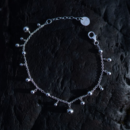 Skir Bracelet, a sterling silver bead bracelet with polished silver beads in varying sizes on a delicate 925 sterling silver chain.