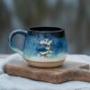 Handmade ceramic mug, "Wild" by Jonna Jinton, featuring an